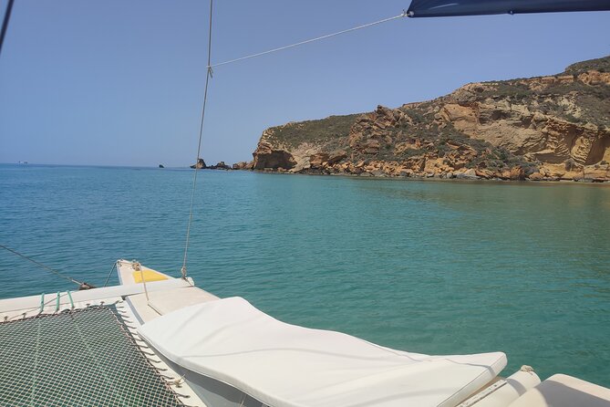 4 Hours Catamaran Tour to the Scala dei Turchi - Le Pergole beach: clear water, easy swim time, and Monterosso Tower views