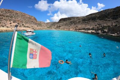 5 hour boat trip to Lampedusa with Sandwich, SUP and Snorkeling - Marine reserve views and the migration monument stop