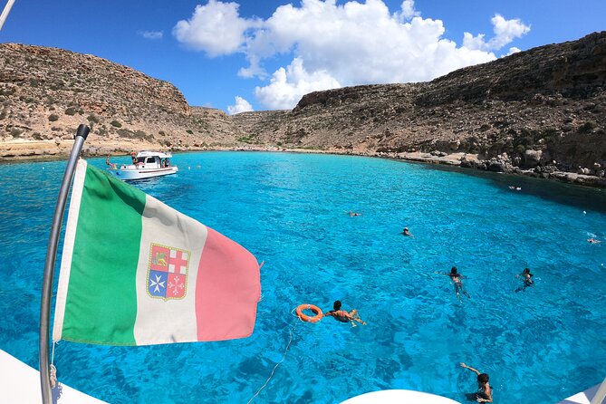 5 hour boat trip to Lampedusa with Sandwich, SUP and Snorkeling - Marine reserve views and the migration monument stop