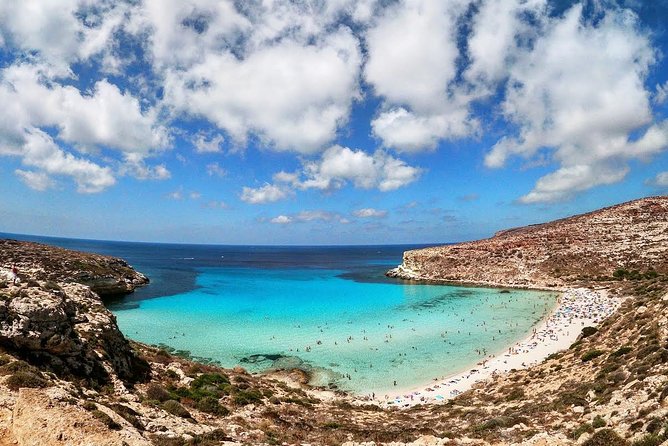 7 hours Boat trip to Lampedusa lunch, SUP and Snorkeling - First Sea Stop: Marine Reserve Views and Wind-Dependent Beach Access