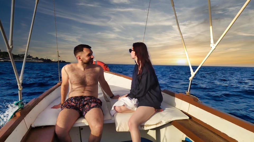 Aci Trezza boat tour sunset and dinner sicilian family home - Ognina Ulysses’ Caves: when the tour moves from viewing to doing