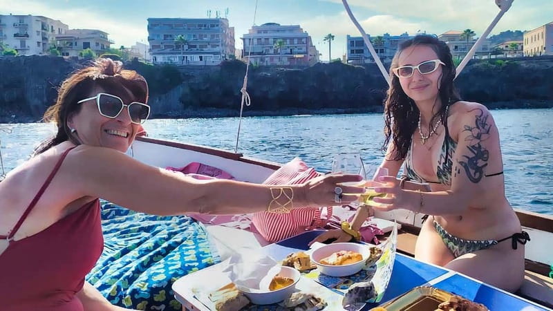 Aci Trezza: Cyclops Coast Boat Tour with Food and Swimming - Lachea Island: volcanic origins and human traces, seen from the sea