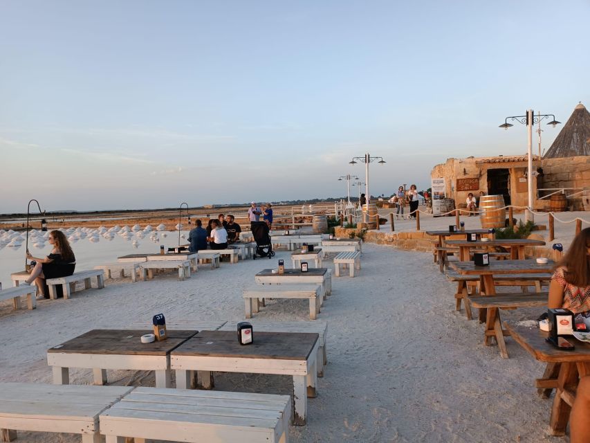 Aperitif in a old tub of salt in Marsala - Languages, provider, and the overall tone