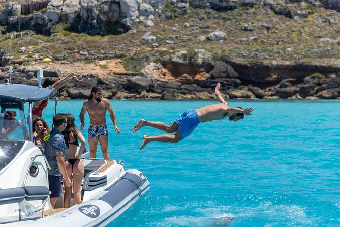 Boat Tour Egadi Day discover Favignana and Levanzo from Trapani - Grotta del Bue Marino: Dark-to-Turquoise Contrast in the Tuff Quarries