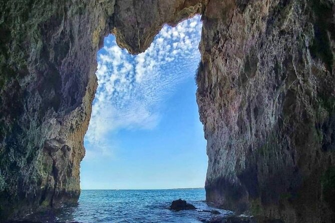Boat tour of Ortigia, sea caves, Pillirina and snorkeling - The onboard feel: music, steering time, and small-vs-big energy