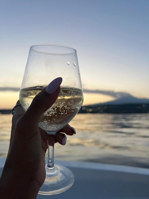 BOAT TOUR WITH APERITIF ON BOARD IN THE CYCLOPS ISLANDS - Aperitif on board at sunset: local wine, Sicilian street food, and Etna in view