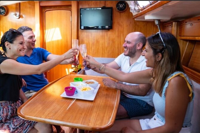 Catania boat tour along the coast with aperitif and snorkeling - Isola Lachea: Cooling Off in Clear Water and Keeping the Day Easy