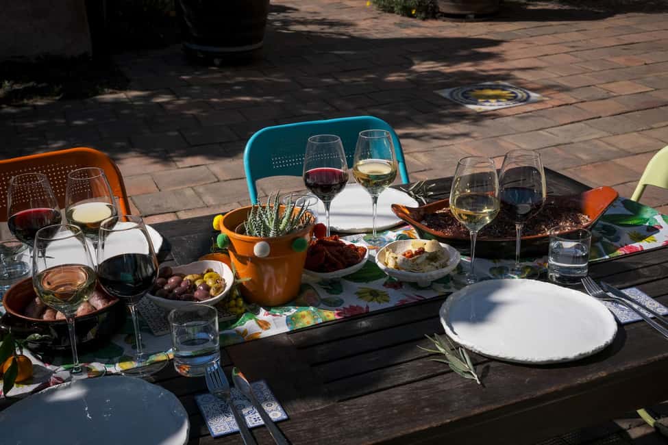 Catania: Etna Urban Winery Sicilian Lunch with Wine Tasting - The Sicilian lunch setup: antipasti, primo, secondo (with wine)