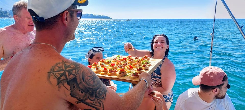 Cefalù: Mini Yacht with Snorkel Stops, Caves and Aperitif - Aperitivo on board: prosecco, snacks, and a fun payoff