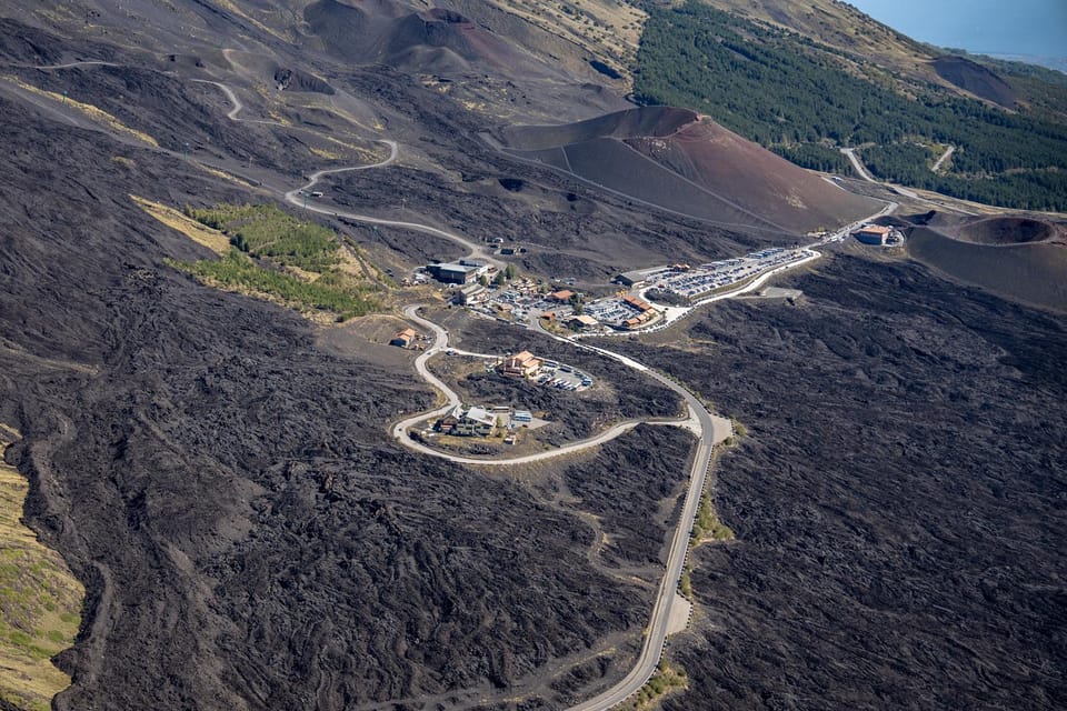 Fiumefreddo: Group Flight Helicopter Tour over Etna - The First Pass Over Etna: conifers, towns, and old lava