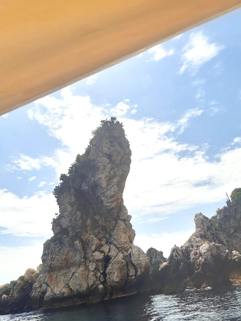 Giardini Naxos: Isola Bella and Grottos Cruise with Aperitif - The aperitif on board: prosecco, snacks, and a Sicilian flavor check
