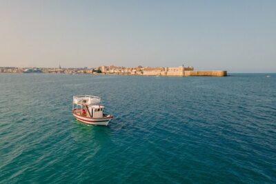Half Day Boat Tour on the Syracuse Coast with Lunch - Ortigia by sea: prison walls, forts, and the waterfront promenade