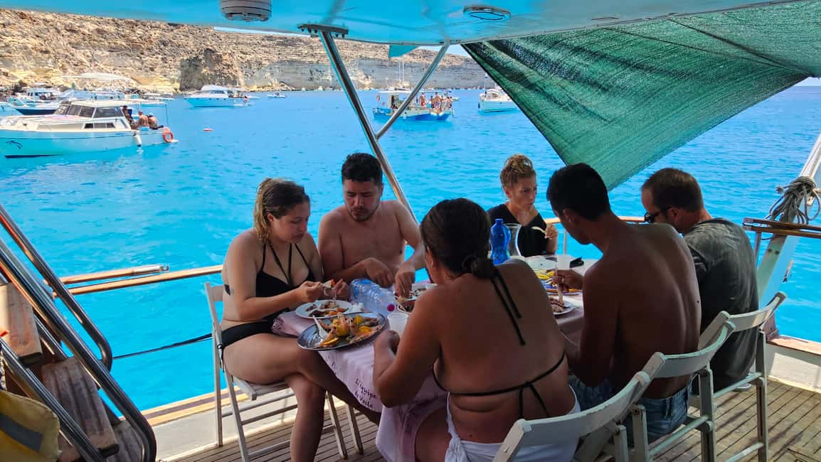 Lampedusa: Yacht excursion, swimming stops and typical lunch - A motor yacht day built around swims, snorkeling, and silence