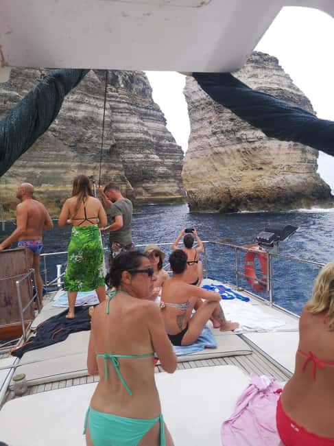 Lampedusa: Yacht excursion, swimming stops and typical lunch - Capo Ponente and Punta Muro Vecchio caves on the north coast
