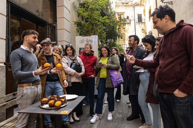 Palermo Street Food & Market Tour by Eating Europe - Piazza Ballaro: slow-grilled sausage and mangia e bevi