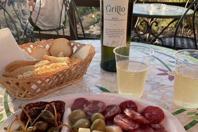 Sciara del Fuoco from the sea with an aperitivo to Ginostra, boat tour - Ginostra first: sunset, stairs, and the sea-only village vibe
