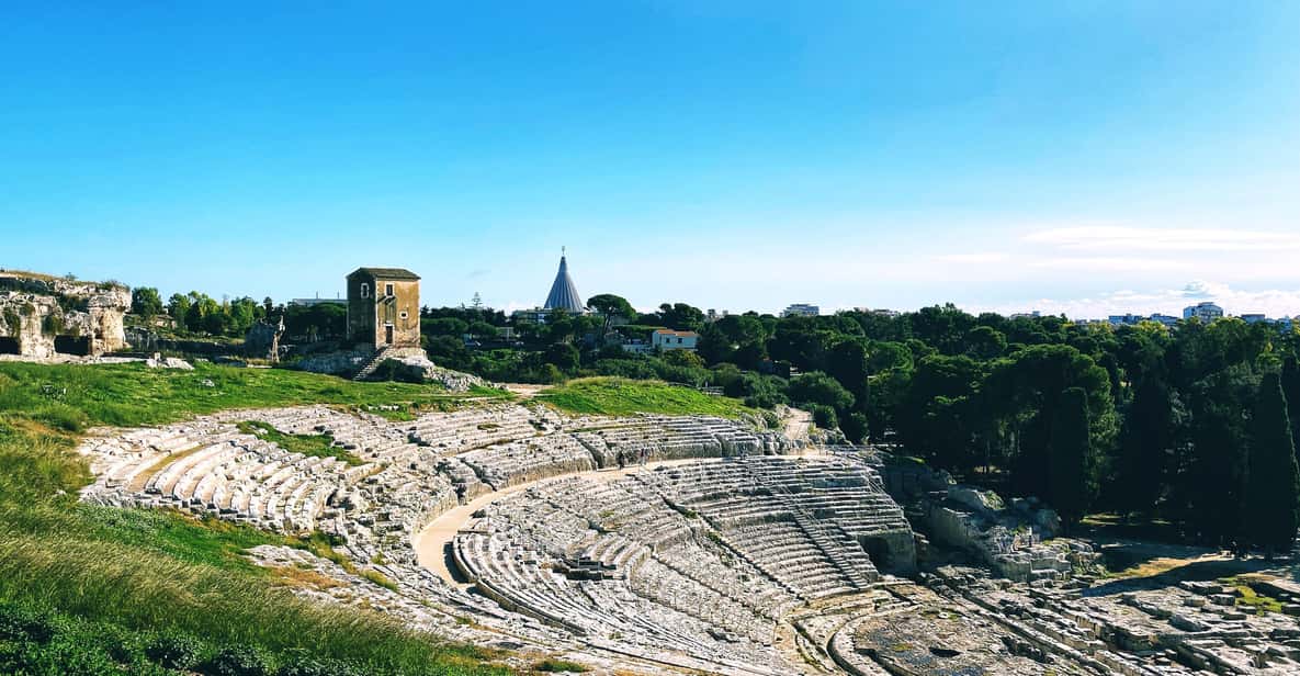 Siracusa: Neapolis’s Archaeological Park small group tour - Roman amphitheater: continuity with a new power