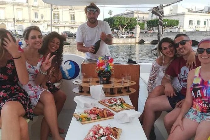 Syracuse Aperitif boat at Sunset island and sea caves - Tips for getting the most out of your Ortigia sunset cruise