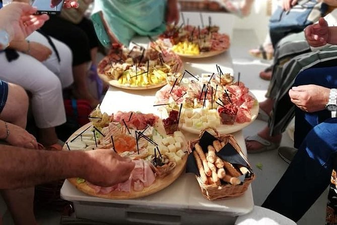 Syracuse Aperitif boat at Sunset island and sea caves - From Ortigia to Capuchin Cove: the cave circuit in plain terms