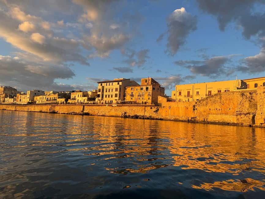 Syracuse: Boat Trip with Lunch, Wine, and Swimming Stops - Entering Syracuse from the water: Ortigia views and prosecco in motion