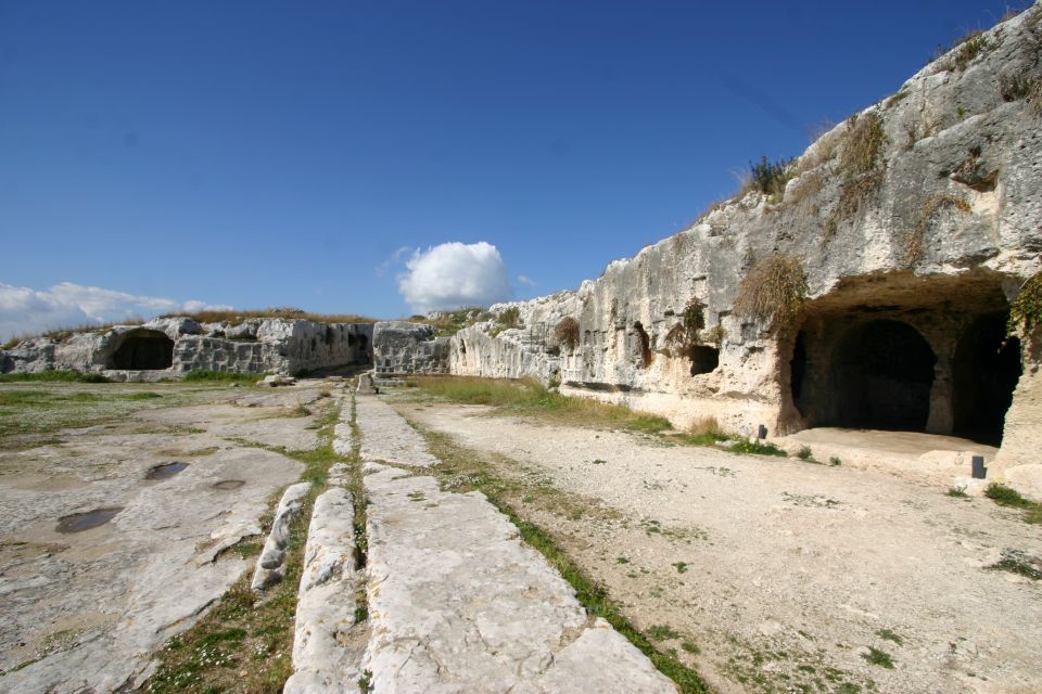 Syracuse: Neapolis Archaeological Park Small Group Tour - Altar of Hieron II and the Roman amphitheater: the story keeps moving