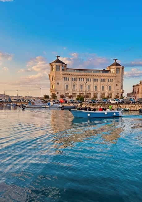Syracuse: Ortigia Island and Sea Caves Boat Tour with Drinks - Castello Maniace and the Ortigia seafront: seeing the big icons from water level