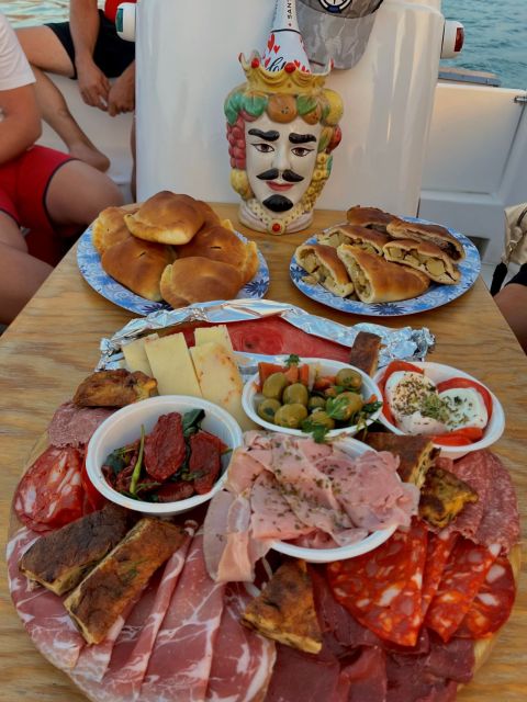 Syracuse: Sunset Aperitif Tour - From Porto Piccolo to sea caves: sailing the Ortigia coastline at golden hour