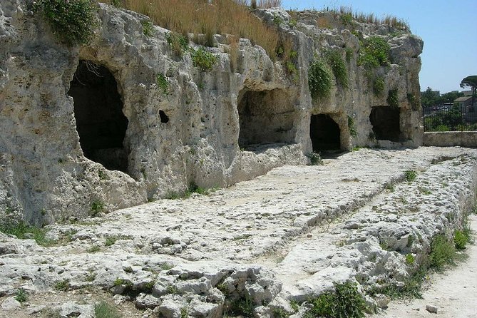 Syracuse's Archaeological Park Private Walking Tour - Roman Amphitheater: the Greek foundation, re-used and re-shaped