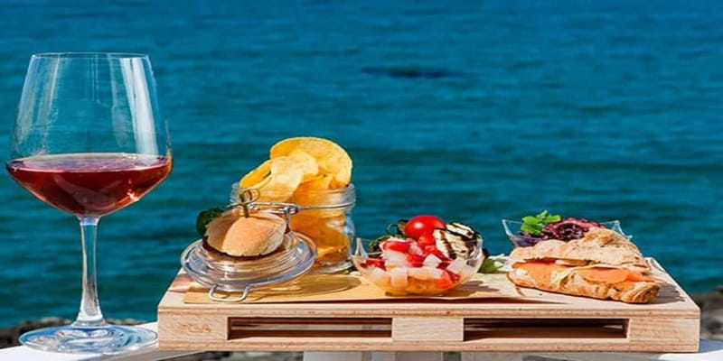 Taormina: Boat Tour with Aperitif on Isola Bella - Aperitif on the water: fruit, almond paste, and relaxed sailing music