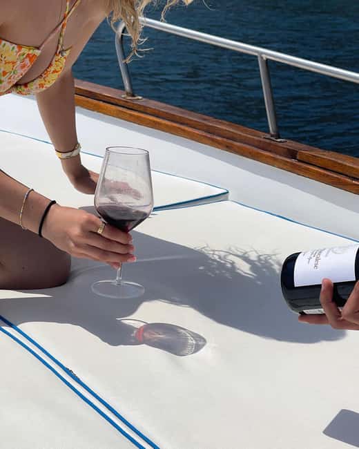 Taormina: Boat Tour with Sicilian Wine Tasting - Traditional Sicilian cuisine onboard: more than a snack