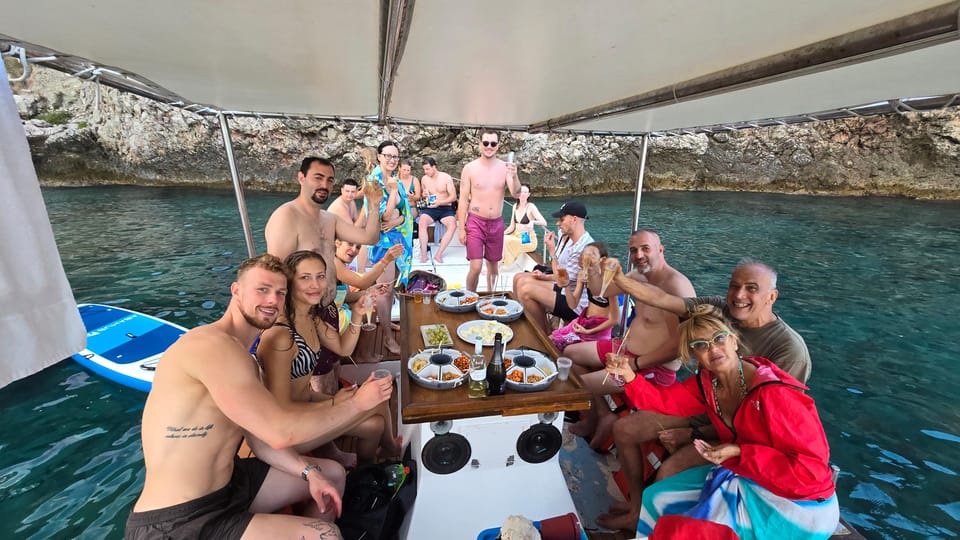 Taormina: Coastline Boat Tour with Aperitif and Snorkeling - Isola Bella snorkeling stop: coral spotting and real swim time