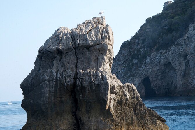 Tour to Baia di Taormina, Isola Bella and Naxos - Stop 1: Taormina Bay, Isola Bella, and Grotta Azzurra caves